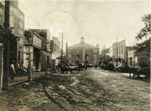 This is the Lawrenceburg Square as it looked during Davis's time, with the David Crockett Courthouse crowning the center. Source: Facebook album of the Old Jail Museum, Lawrenceburg, TN.